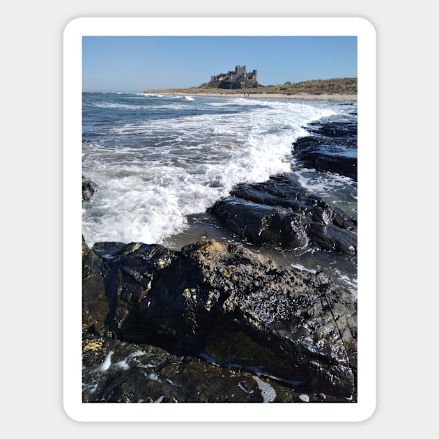 Waves near Bamburgh Castle in Northumberland Sticker by richflintphoto